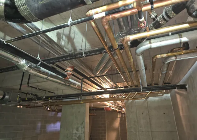 Overhead copper distribution pipework in a commercial building
