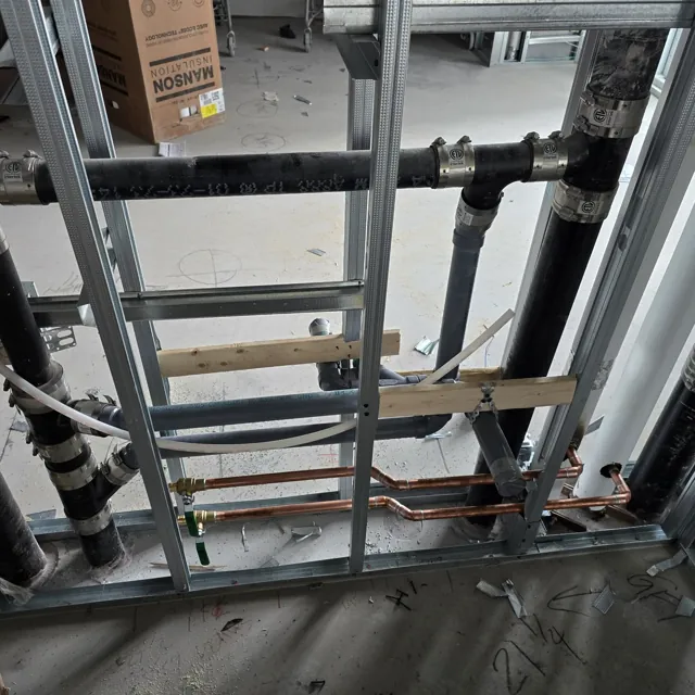 Shower supply piping and drainage inside exposed framing