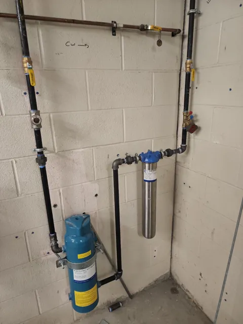 Water-treatment assembly with connected copper pipework